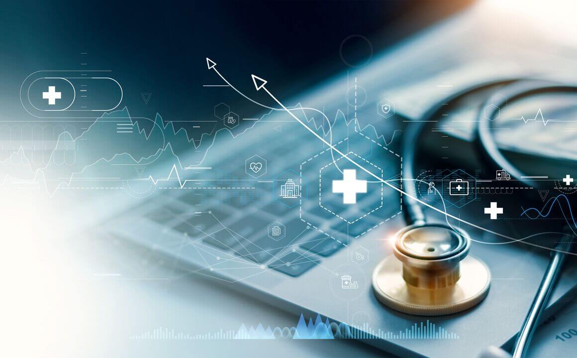 A stethoscope rests on a laptop, with medical icons superimposed